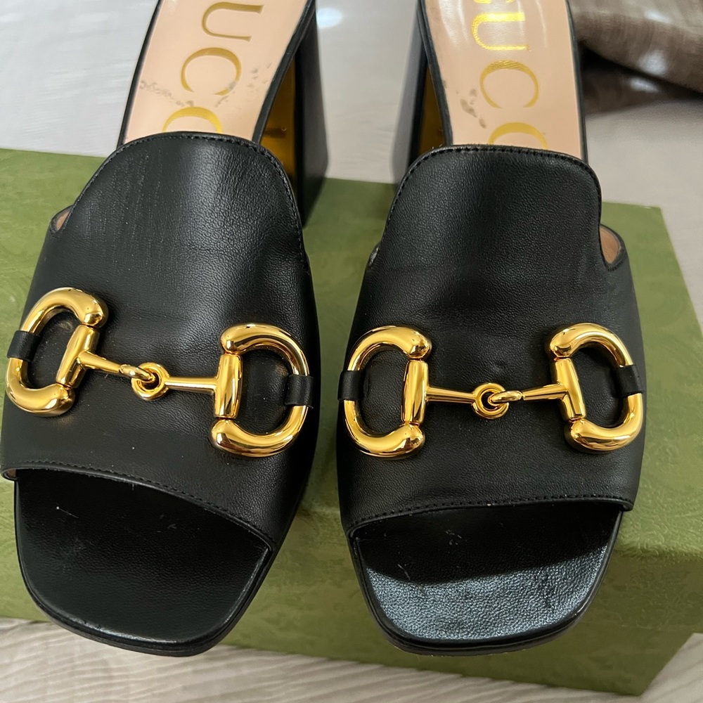 Gucci Black Mules with Gold Accents